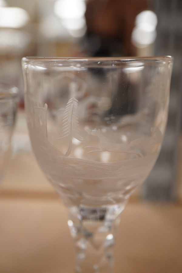 Four Georgian wine glasses, three with engraved bowls, three with faceted stems, and one with an air twist knopped stem and stepped foot, tallest 16cm